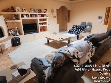 Living area featuring arched walkways