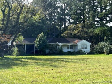 Single story home featuring a front yard