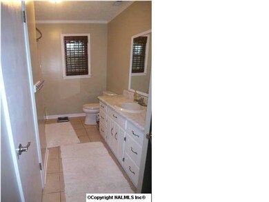 Guest Bath with tile, linen closet and new fixtures.