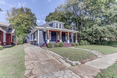 View of front facade with a porch and a front lawn