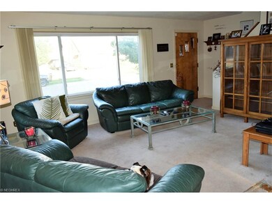 Living room.   Seller will make allowance for repl