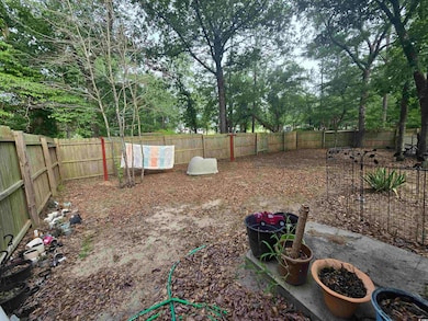 One of two fenced in private yard spaces.  Front portion of the home.