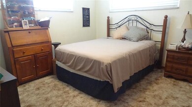 Bedroom with a ceiling fan. Hardwood Floors under 
