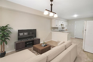 Living room featuring light tile patterned flooring