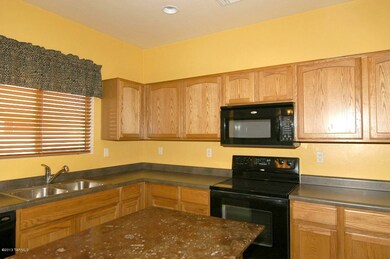 Kitchen w. Fossil Granite Counter Top.