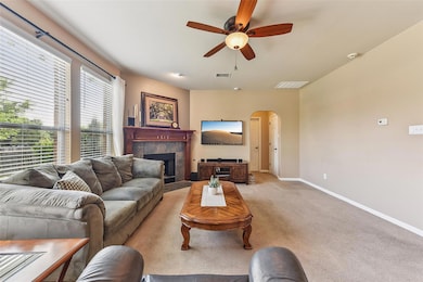 Living area featuring arched walkways, a ceiling 