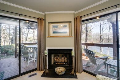 Flanked by large sliding doors to the waterside de