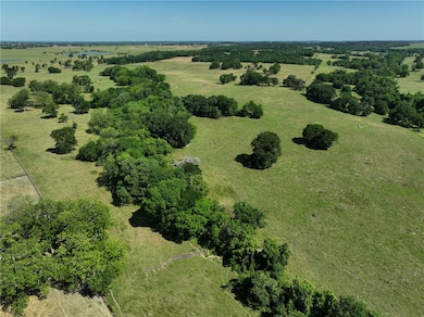 Aerial view of property and surrounding area with
