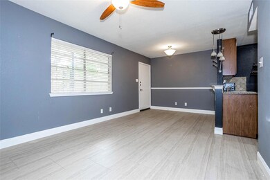 Unfurnished living room with ceiling fan and ligh