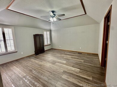 Primary bedroom with walk-in closet
