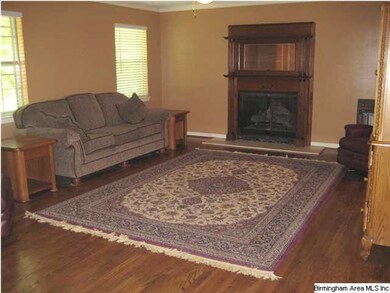 Large family room with hardwood flooring and beaut