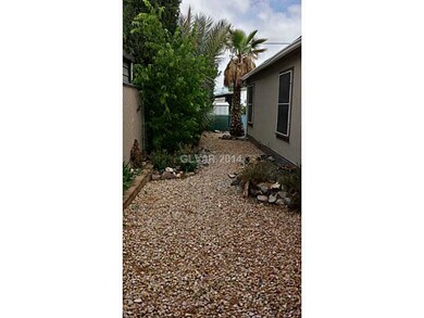 Property Photo. West Side of Yard