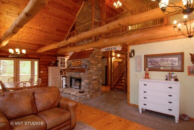 View into second story loft area. 2 story gas star