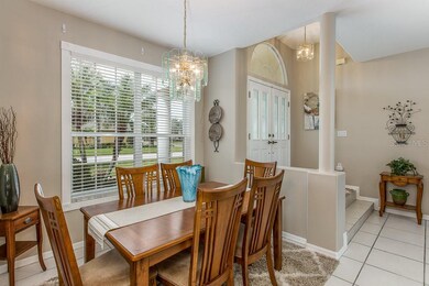 Another view of formal dining and entry