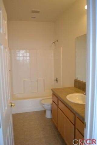 Hall Bath upstairs with high ceilings and tile cou