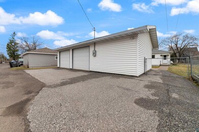 Garage with fence and a gate