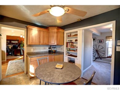 View 2 of kitchen with build in shelving, decorati