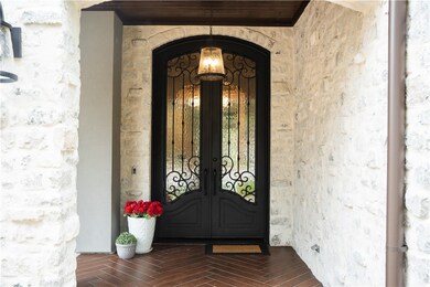 Grand entrance w/ tall French Iron doors