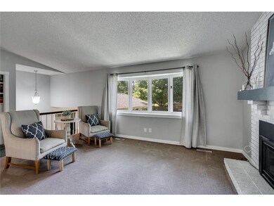 Spacious living room with lots of natural light th