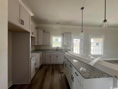 Kitchen featuring decorative light fixtures, light