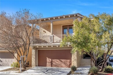 View of front of property featuring an attached ga