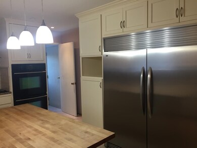 Kitchen with island garage on North side.
