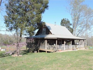 3 bedroom Cabin in the Trees!  Large open and screened porches.