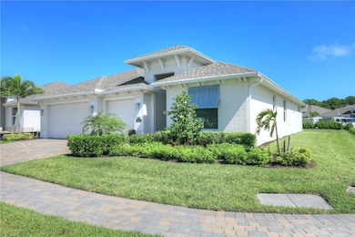 View of front of house with a front lawn, stucco siding, a garage, a shingled roof, and driveway