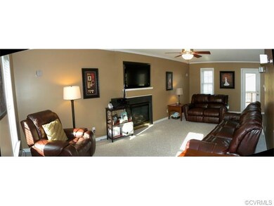 Pretty Great Room with gas fireplace and door to D