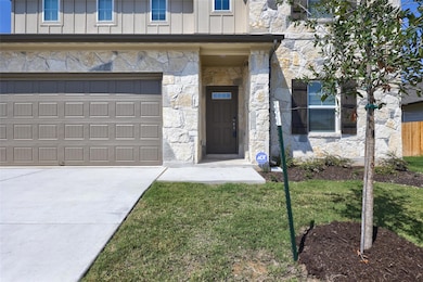 Property entrance featuring stone siding, board a