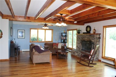 Love the living area and custom stone fireplace.  