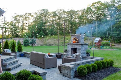 BEAUTIFUL PAVER PATIO WITH OUTDOOR FIREPLACE