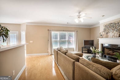 From the front door, enjoy a clear view through the open layout to the spacious family room and kitchen perfect for everyday living and entertaining