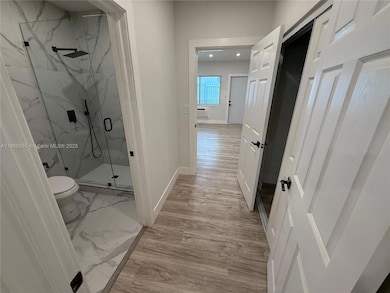 - Hallway view from bedroom entrance