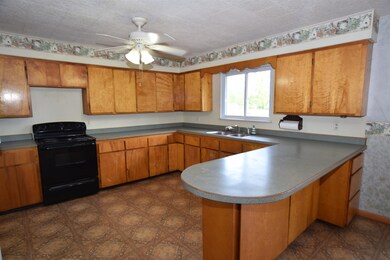 Plenty of space to work you magic in this kitchen!  Talk about counter space! You can spread out with easy access to the refrigerator, range and sink.  Plenty of storage cabinets for cooking supplies and food storage.