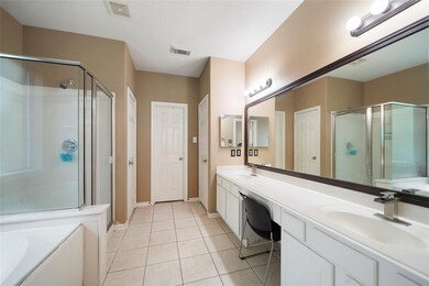 The Primary en-suite has double sinks, a jetted tu