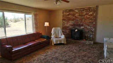 Large Living Room With Brick Wood Burning Fireplac