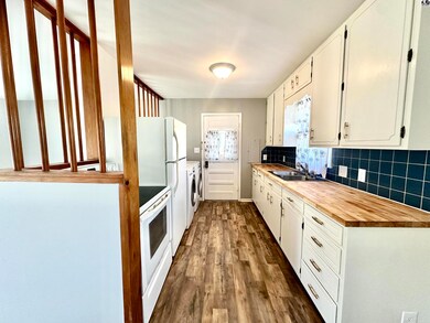 Kitchen with view of back door.