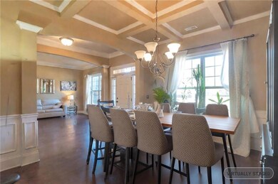 Dining room featuring beam ceiling, a notable chan