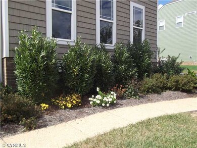 Exterior Front - Sidewalk lined with organic plant
