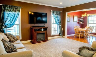 Living room opens to the lovely country kitchen di