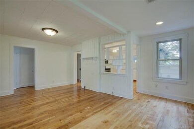 view from living room to kitchen and bedroom hall