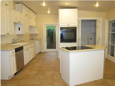 Kitchen - Updated cabinets/countertops, cooking island, vaulted ceiling, opens to dining!