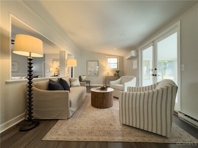 Living room featuring dark hardwood / wood-style f