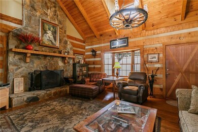 IMPRESSIVE stone fireplace with thick wood mantle