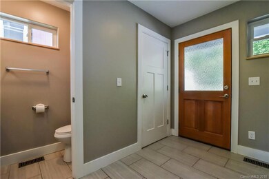 Spacious entry foyer with half bath and coat storage closet!