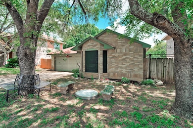 View of outbuilding with driveway and an attached