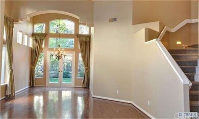 Volume Ceilings and Hardwood Floors in Living and 
