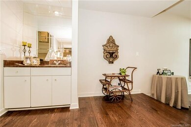 A small wet bar sits on the landing above a sunken
