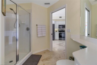 Bathroom featuring toilet and an enclosed shower
